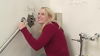 Naughty blonde finds a glory hole and gets a mouthful of cum