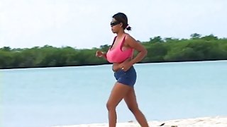 Huge boobs chick jogs on the beach