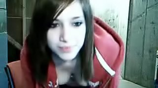 A cute teen masturbates her pussy in front of a webcam