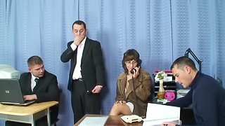 Two office colleges fuck their mature lady friend while in a office meeting
