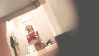 Leggy amateur is spied in candid shorts in dress room