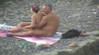 Lewd plump couple had fun while spooning each other on the beach