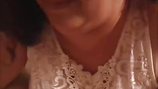 MILF with really huge tits gives a boob job