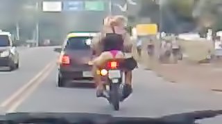 Hussy in thong riding a bike gets caught on a dash cam