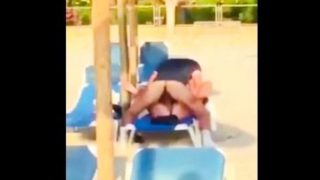 Beach voyeur films a horny couple enjoying wild sex action