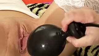 Big toy to enlarge babe's shaved twat