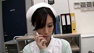 Horny Japanese nurse Anna Noma moans while playing with a dildo
