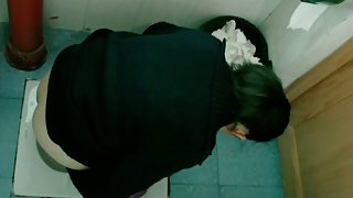 Asia sweeties peeing in front of a hidden toilet cam