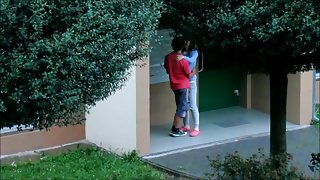 Beautiful college girl college girl couple kissing cuddling and caressing outside