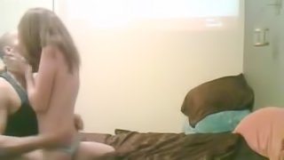 A guy fucks his cute brown-haired girlfriend in the dormitory