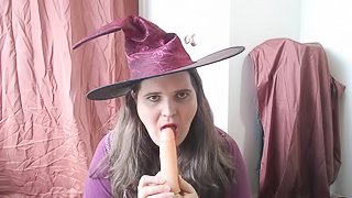 Halloween witch sucking a dildo