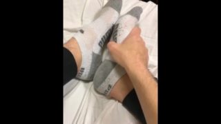 Teen boy feet in puma ankle socks and smooth soles