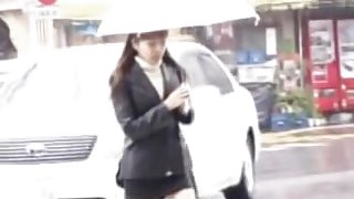Rainy street sharking scene of some truly glamorous Japanese chick