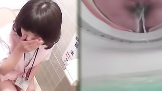 Cute Japanese nurse is having a piss in the toilet, while hidden cam is filming