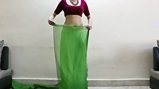 Beautiful Indian girl with sexy curvy body gives saree lesson
