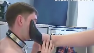 Collared guy licks the toes of his beautiful mistress