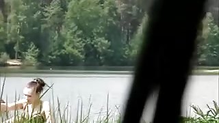 girl sunbathing on the pond