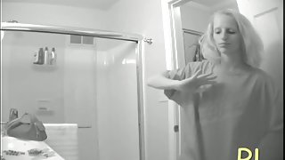 Hidden bathroom cam video of a blonde with tiny titties