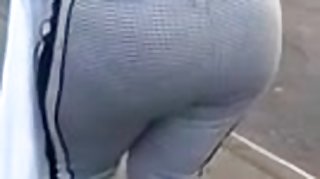 Candid booty milf waiting at bus stop