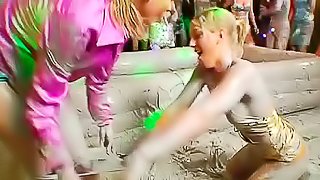 Slick mud on wrestling girls