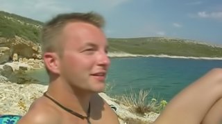 Twinks have outdoor sex by the water