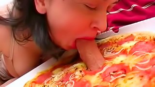 Sexy babe is sucking dick through the pizza