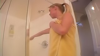 Watch this video to see this busty blonde masturbating in the shower