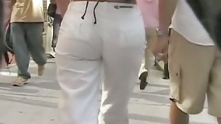 Gorgeous round ass in semi-transparent pants