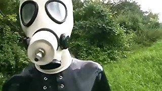 Rubber Girl Full in Black Latex Catsuit and Mask Plays with herself Outdoor in a Meadow - Part 2