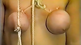 Slave girl gets her breasts tortured with ropes