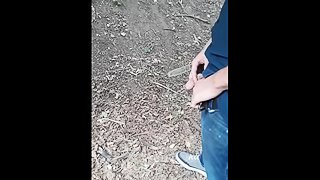 My man pissing in the woods