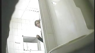 Hidden cam in wc shoots girl lifting skirt up above bowl
