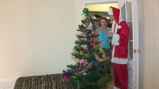 Ludmila gives a blowjob to Santa Claus and lets him smash her butt