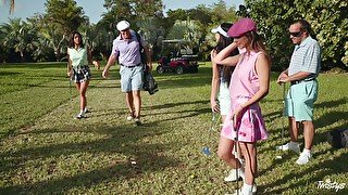 Golf players Jade Amber and Adria Rae playing with a large pole