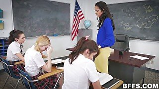 Perverted lesbian teacher is spanking sexy teens and fucking them on the table