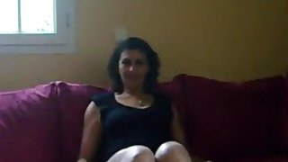 Milf makes a sextape with her man on the sofa