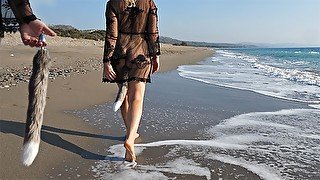 Sexy woman at the beach takes a foxtail butt plug in her ass - public outdoor anal plug