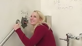 White Girl with a Pierced Tongue Sucking Black Cock in a Gloryole