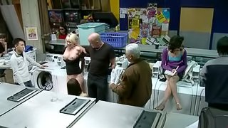 Horny Missy Woods gives a blowjob in a laundry in public