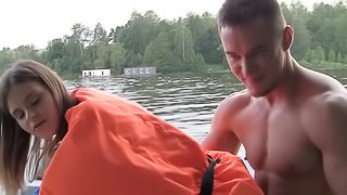 Hardcore on a boat with a cutie in a life vest