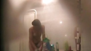 Fem flashes bushy nub and tits on hidden shower cam