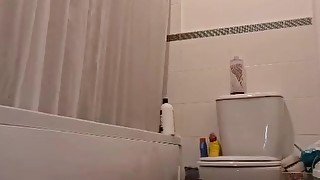 She enters her bathroom while he is taking a shower and starts sucking his cock.