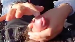 A hot Asian girl gives a blowjob to her boyfriend outdoors