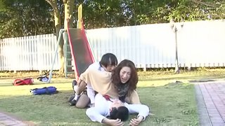 Japanese chick in stockings gets threesomed in a park