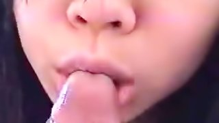 sexy brunette from Japan is sucking that long dick