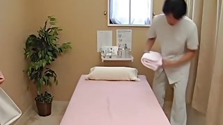 Perfect Japanese fucking her masseur in voyeur massage clip