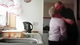 Chubby granny gets fondled in the kitchen by her hubby
