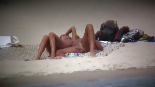 Hot wife flaunts her bushy muff on a nudist beach