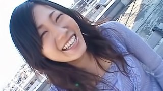 Toying with an Asian girlfriend's hairy pussy outdoors