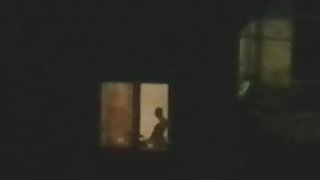 Horny couple caught playing at open window